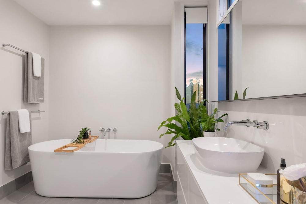 Luxury bathroom renovation in Chelsea, London with twin vanities and premium brassware