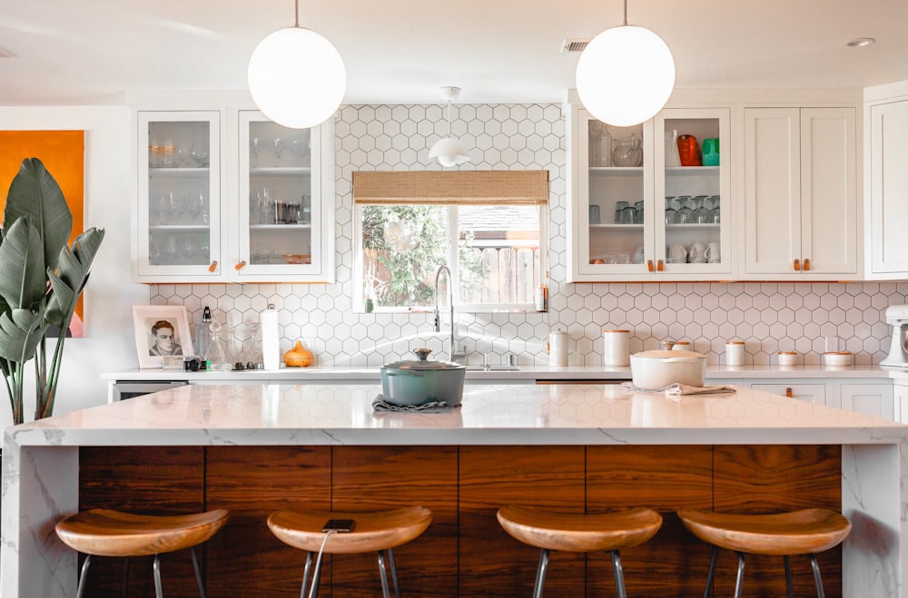Modern kitchen refurbishment in Kensington with marble worktops